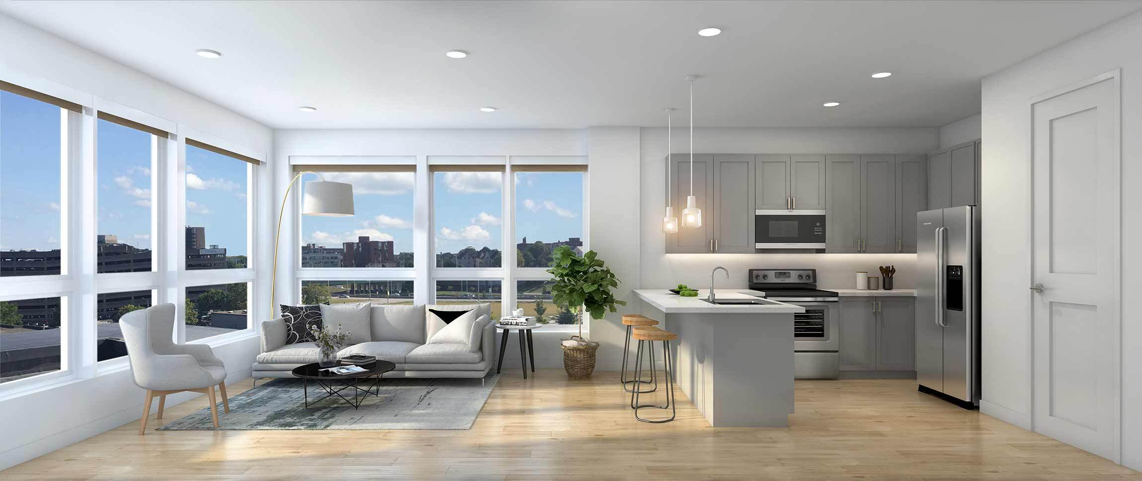 A modern kitchen with a dining table and chairs is adjacent to a living room with a couch and a coffee table.